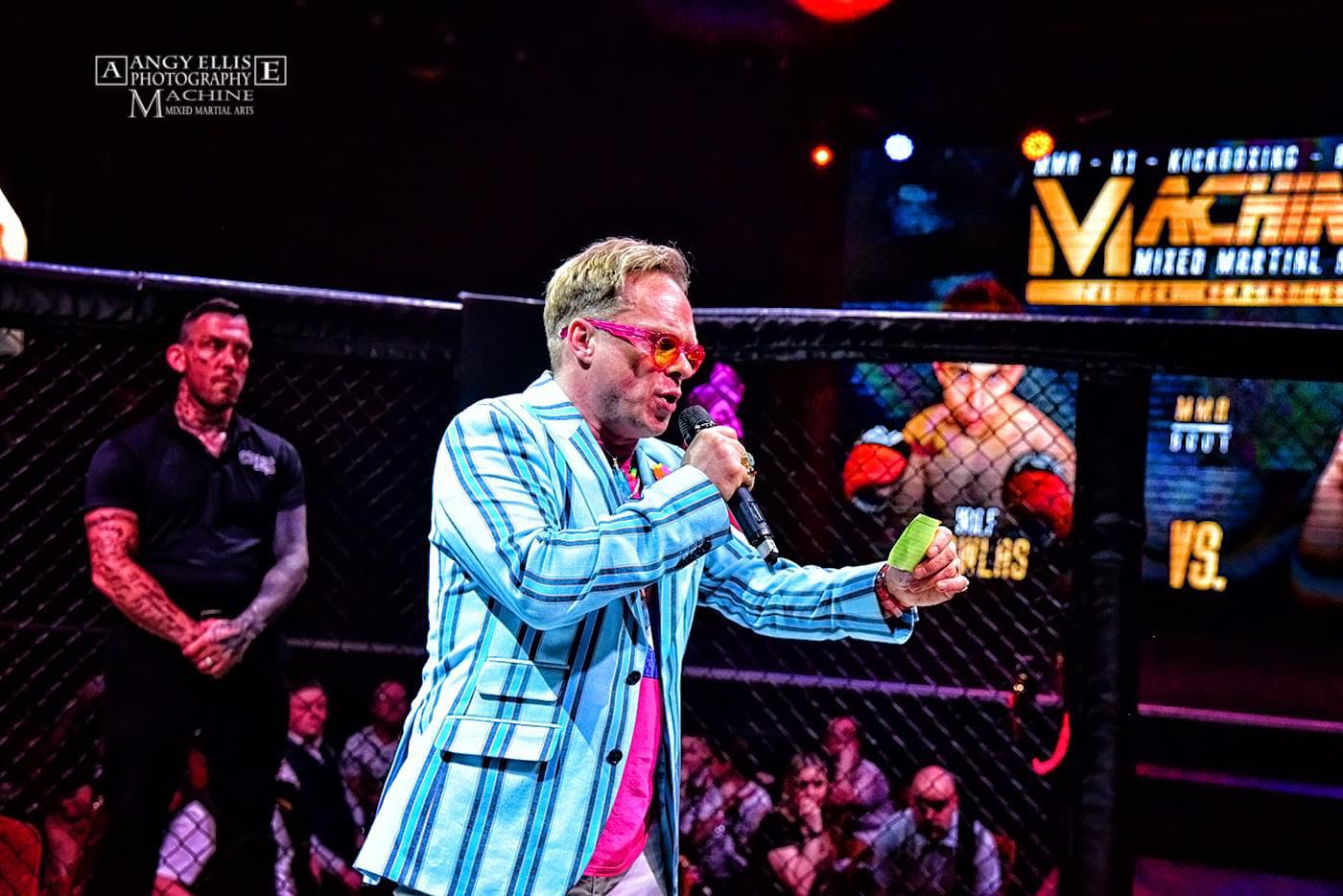 Christian Steel announcing inside the cage at a Machine MMA event